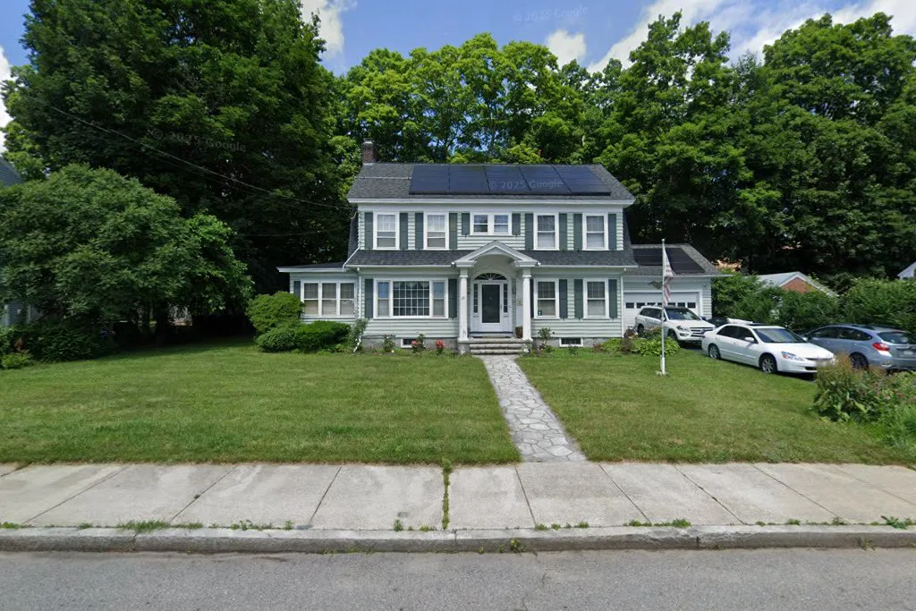 Front exterior of a two-story colonial operating as a recovery residence