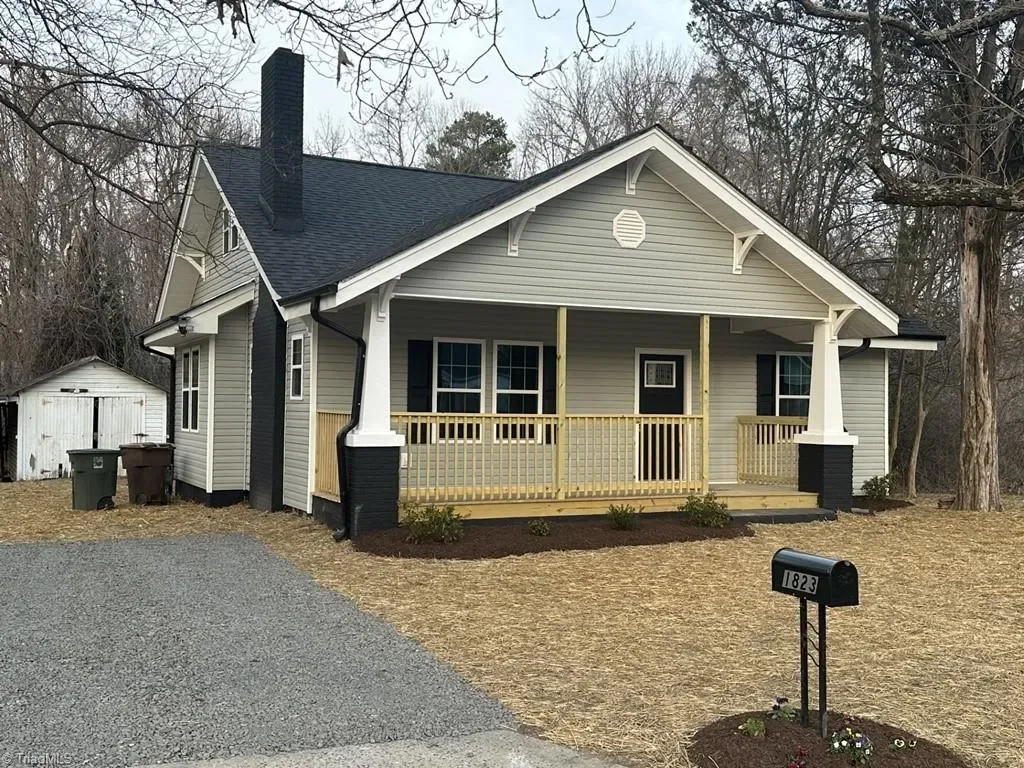 Front exterior of a renovated craftsman home used as recovery housing